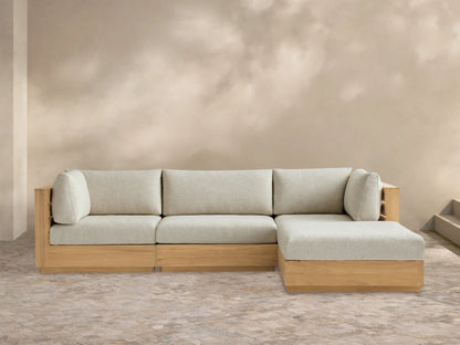 Bal Harbour Outdoor Teak Four-Piece Sectional, L-shaped, with natural teak frame & Eden Oyster cushions on tiled floor.