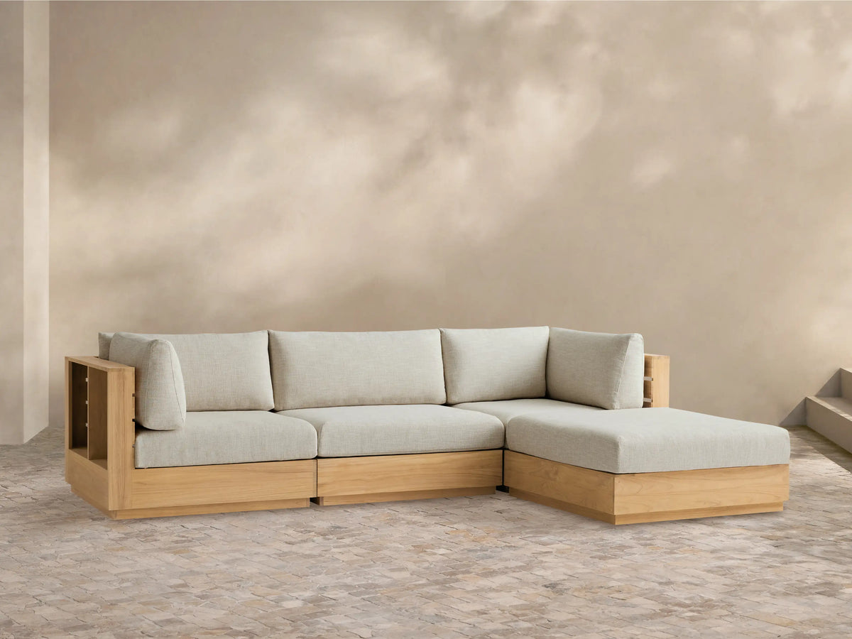 Bal Harbour Outdoor Teak Four-Piece Sectional, L-shaped, with natural teak frame & Eden Oyster cushions on tiled floor.