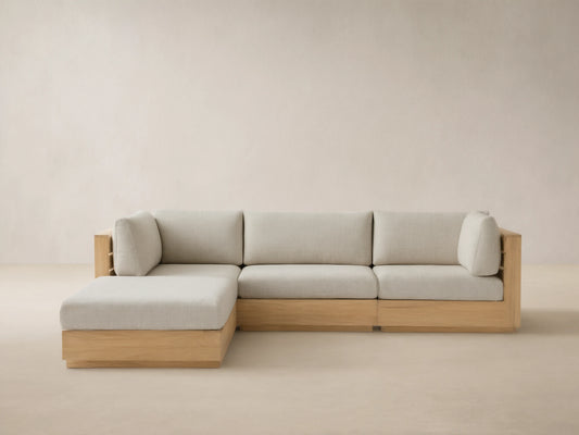 Bal Harbour Outdoor Teak Four-Piece Sectional, L-shaped, with natural teak frame & Eden Oyster cushions on tiled floor.