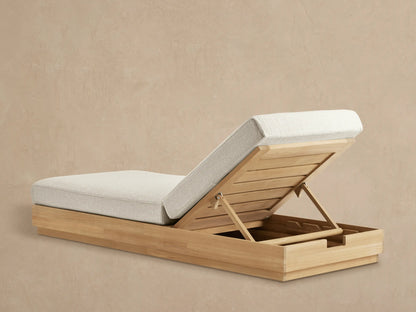 Bal Harbour Outdoor Teak Chaise: close-up of natural teak frame, headrest lifted, revealing adjustable support and light cushion.