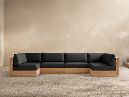 Bal Harbour Outdoor Teak Six-Piece Sectional, U-shaped, with natural light teak frame and dark gray cushions on a tiled floor.
