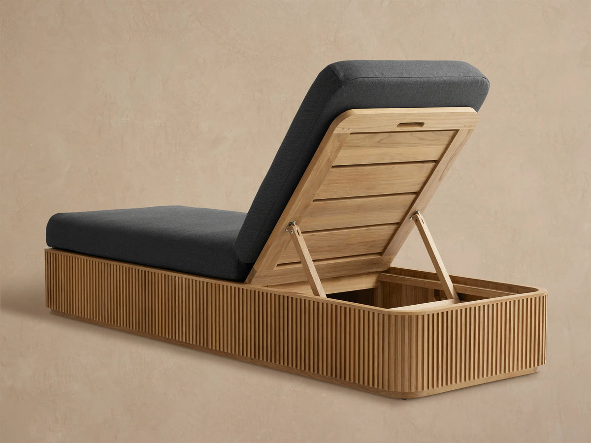 Beaumont Outdoor Teak Chaise, natural teak with vertical slats, dark gray cushion on raised slatted back, exposed mechanism.