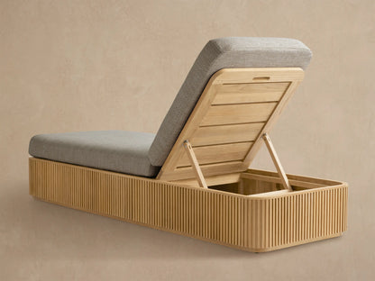 Beaumont Outdoor Teak Chaise, close-up of natural teak frame with vertical slats, light grey cushion, and raised adjustable backrest.