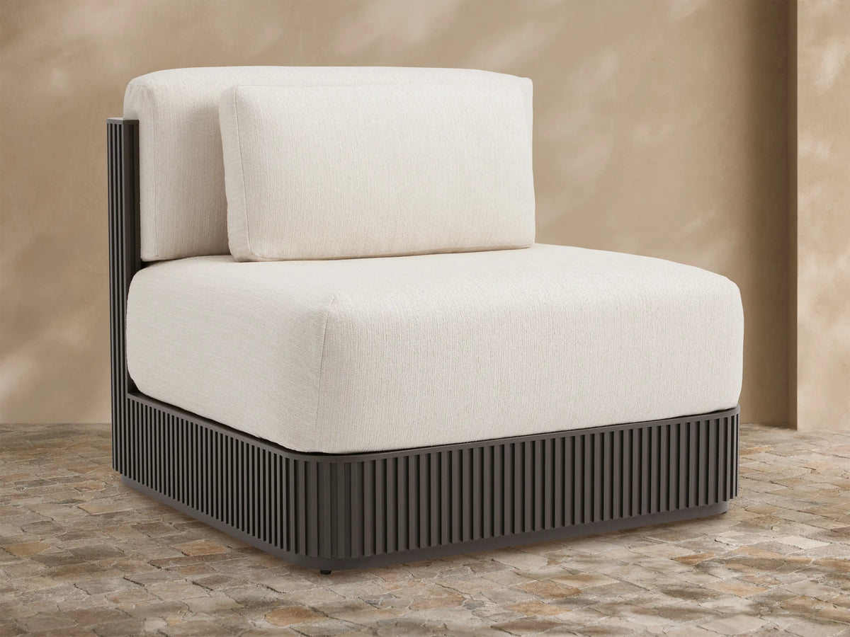Beaumont Outdoor Aluminum Lounge Chair with dark slatted aluminum base and light cream performance fabric cushions.