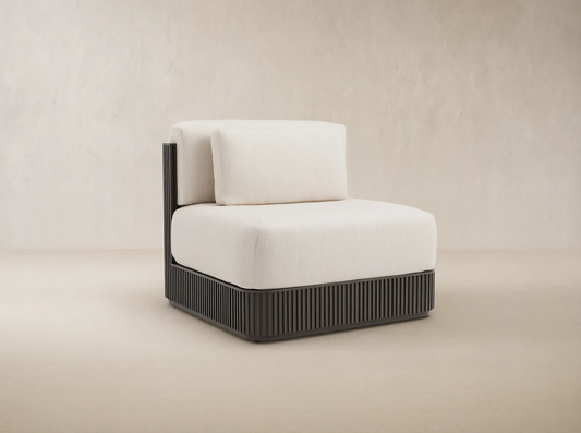 Beaumont Outdoor Aluminum Lounge Chair with dark slatted aluminum base and light cream performance fabric cushions.