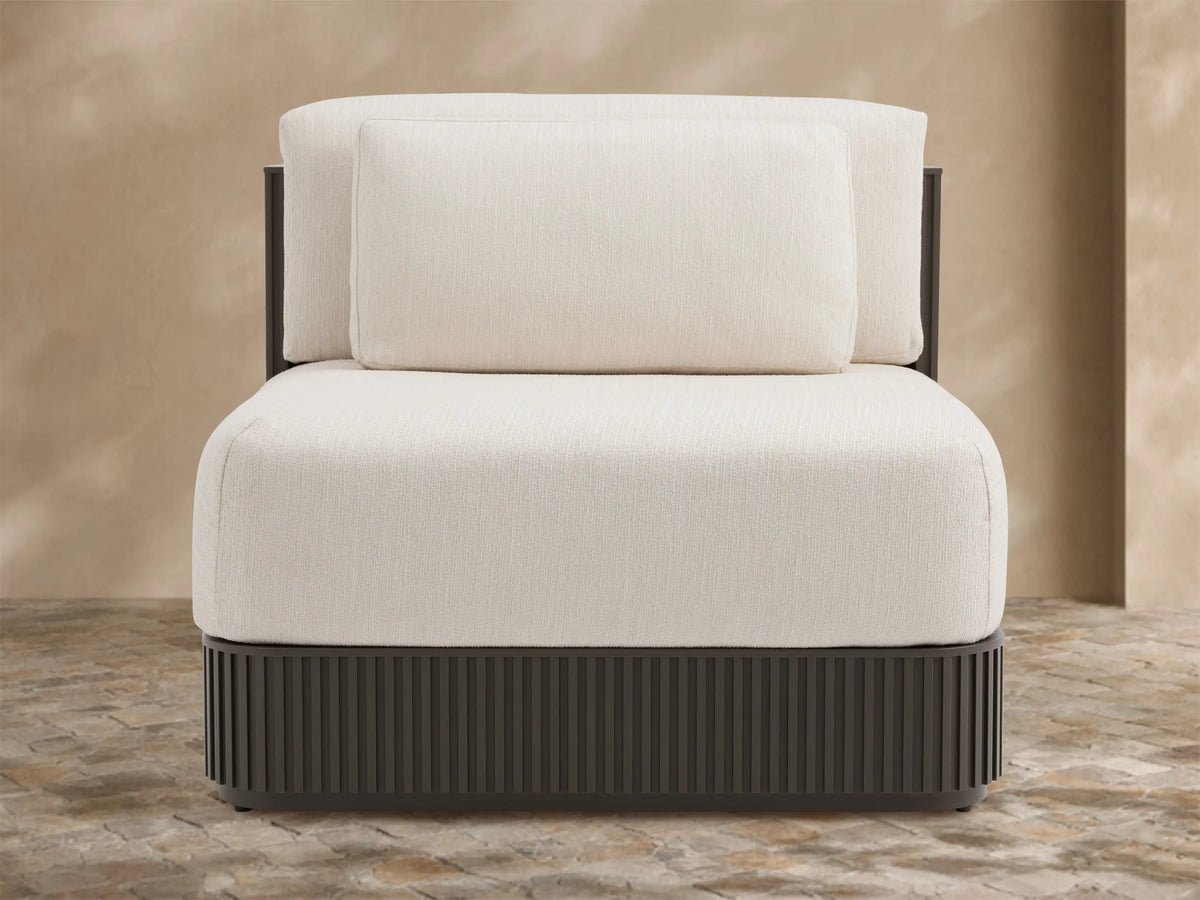 Beaumont Outdoor Aluminum Lounge Chair with dark slatted aluminum base and light cream performance fabric cushions.