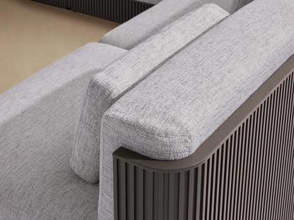 Beaumont 6-piece outdoor sectional with light gray cushions, dark fluted aluminum frame, and a chaise, on a patio.
