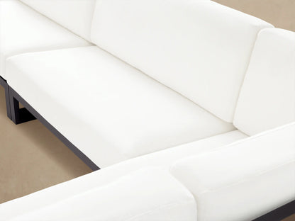 Canyon Outdoor Aluminum Three-Piece Sectional, L-shaped with dark gray frame and white cushions, on a light-colored patio.