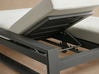 Canyon Outdoor Aluminum Double Chaise: charcoal gray frame, white cushions, one backrest angled up, side view.