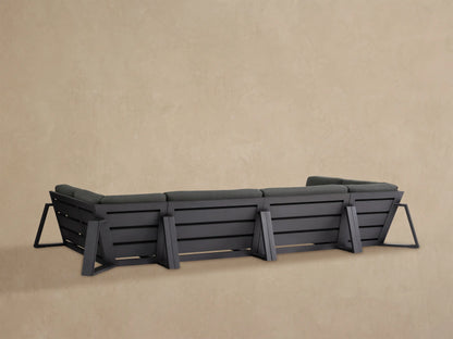 Close-up of a dark grey Canyon Outdoor Aluminum Sectional armrest with textured charcoal fabric cushions and grey aluminum frame.