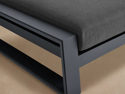 Side view of a Canyon Outdoor Aluminum Double Chaise with dark gray frame and dark gray cushions, one backrest elevated.