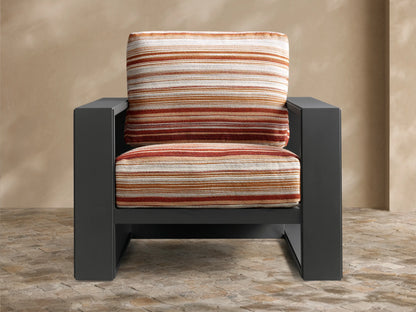 Rear view of the Canyon Outdoor Aluminum Lounge Chair with a black frame and striped cushions in orange, cream, and brown.
