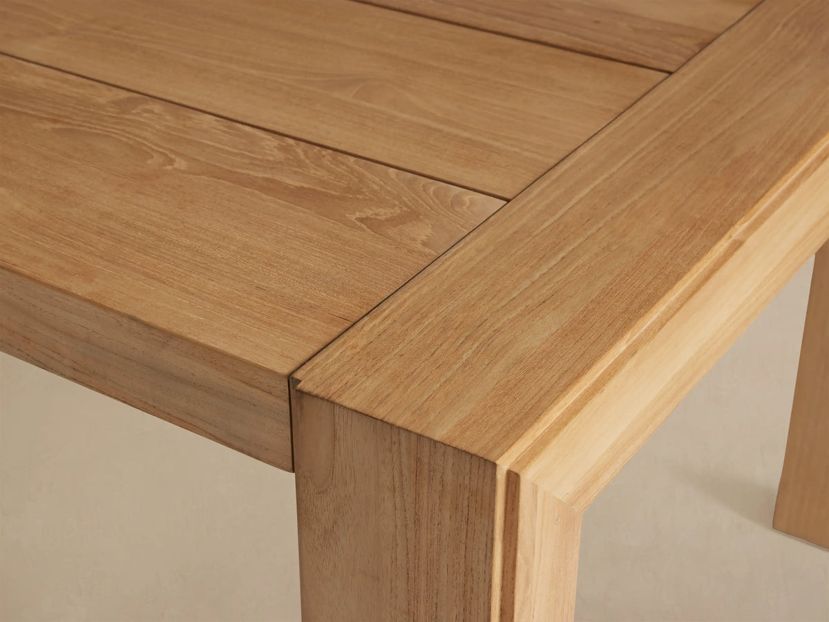 Top view of the Canyon Outdoor Teak Dining Table, featuring its natural light brown teak wood construction with horizontal slats.