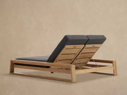Canyon Outdoor Teak Double Chaise with dark grey cushions, showing adjustable teak backrests supported by metal rods.