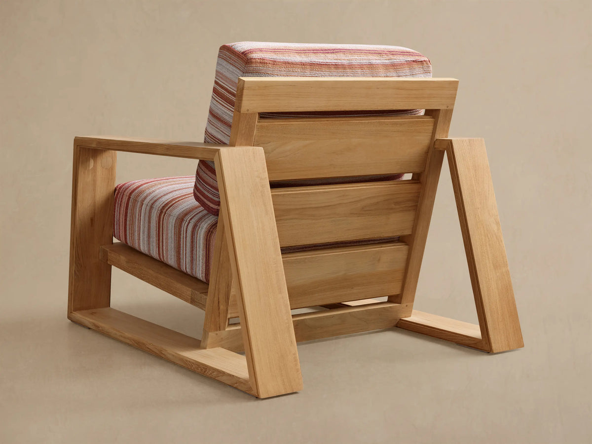 Rear view of natural teak Canyon Outdoor Teak Lounge Chair with multi-color striped cushions.