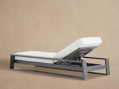 White cushion on dark gray slatted aluminum Canyon Outdoor Chaise backrest, tilted up, showing adjustable mechanism.