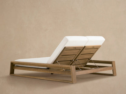 Close-up of Canyon Outdoor Teak Double Chaise backrest, raised with white cushion, natural weathered teak wood, and metal mechanism.
