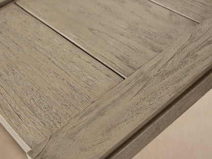 Canyon Outdoor Teak End Table, square, two-tier, grey distressed teak, on a tiled patio against a beige wall.