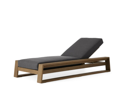 Canyon Outdoor Teak Chaise in profile view with a grey cushioned seat and adjustable backrest. Natural teak frame.