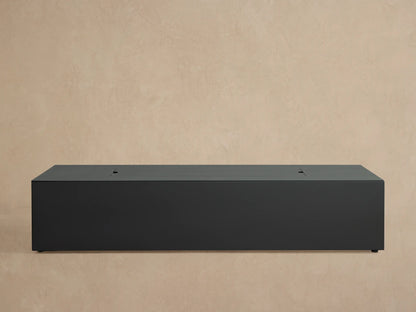 Coden Rectangular Propane Fire Pit, dark gray with textured finish. Top has black lava rocks. Side shows ignition and control knob.