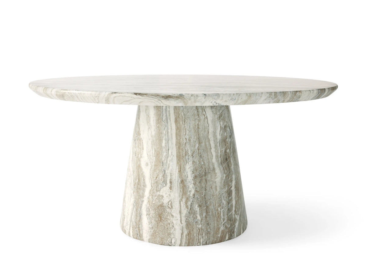 Round Edgewater Outdoor Dining Table. Faux marble top with white, grey, and brown veining, centered on beige.