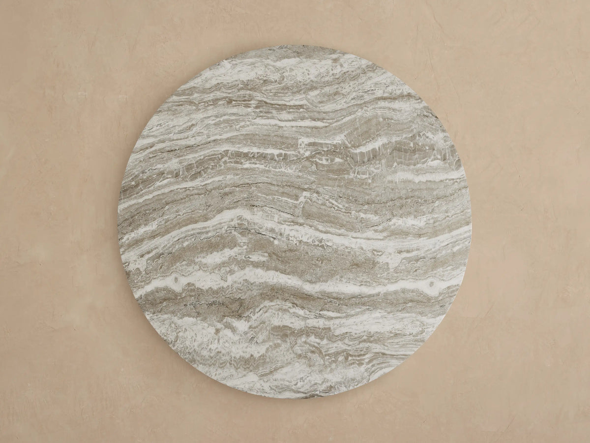 Close-up of Edgewater Outdoor Dining Table's jade faux marble top with intricate white, brown, and grey veining.
