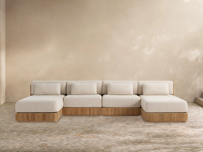 Front view of Beaumont Outdoor Four-Piece Double Chaise Sectional, with light beige cushions and slatted teak wood base.