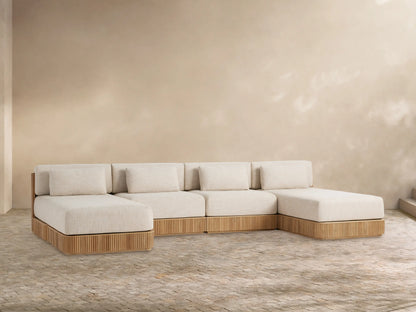 Front view of Beaumont Outdoor Four-Piece Double Chaise Sectional, with light beige cushions and slatted teak wood base.