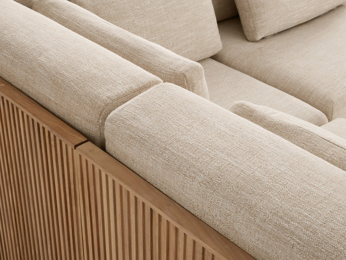 Front view of the Beaumont Outdoor Six-Piece L-Shaped Sectional with light beige cushions and a slatted natural teak base.
