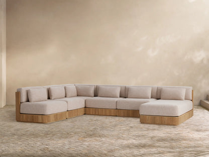 Front view of the light beige cushioned Beaumont Outdoor Teak Six-Piece Sectional with Chaise, featuring a slatted natural teak wood base.