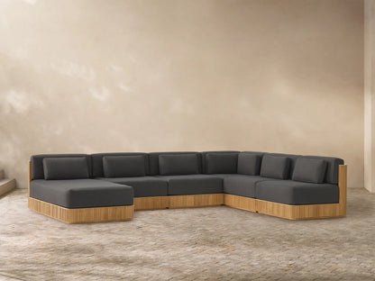 U-shaped Beaumont Outdoor Teak Six-Piece Sectional with chaise, dark grey cushions, and slatted natural teak base.