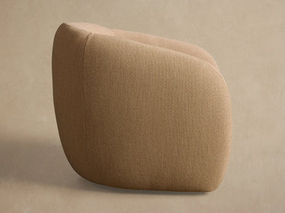 Rear view of the beige woven Fresno Outdoor Swivel Chair, highlighting its curved back and vertical seam detail.