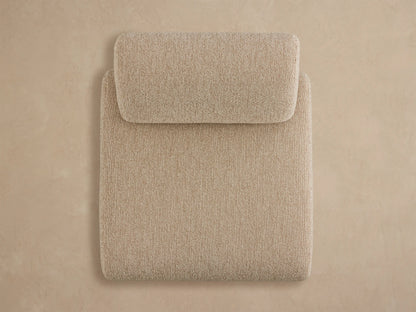 Angled rear view of a Gianni Outdoor Lounge Chair upholstered in light beige textured fabric with a modern, blocky design.