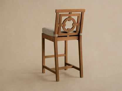 Hamptons Outdoor Barstool, weathered fawn teak. Backrest with geometric circle design. Light woven seat cushion, white rope trim.