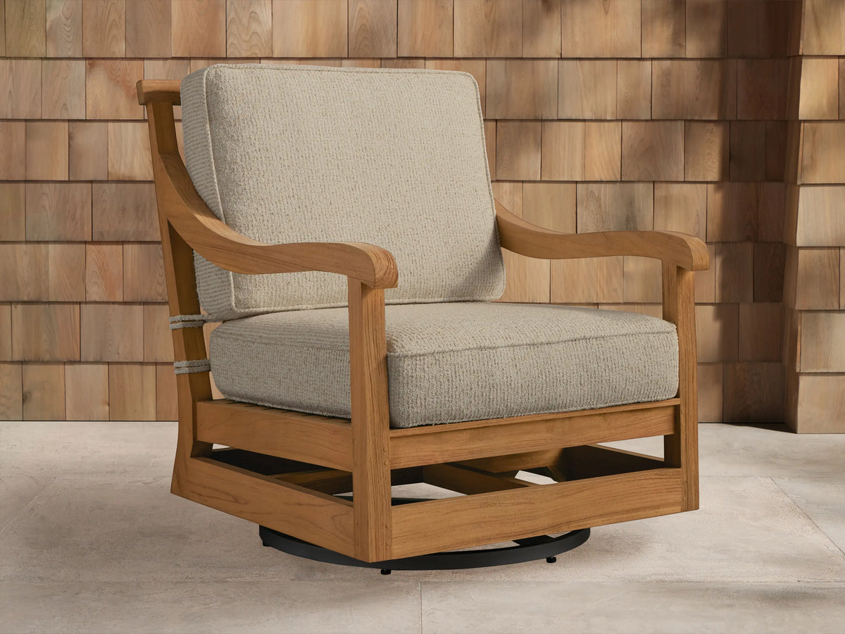 Hamptons Outdoor Swivel Chair in weathered fawn teak with light beige cushions, angled on an outdoor patio setting.