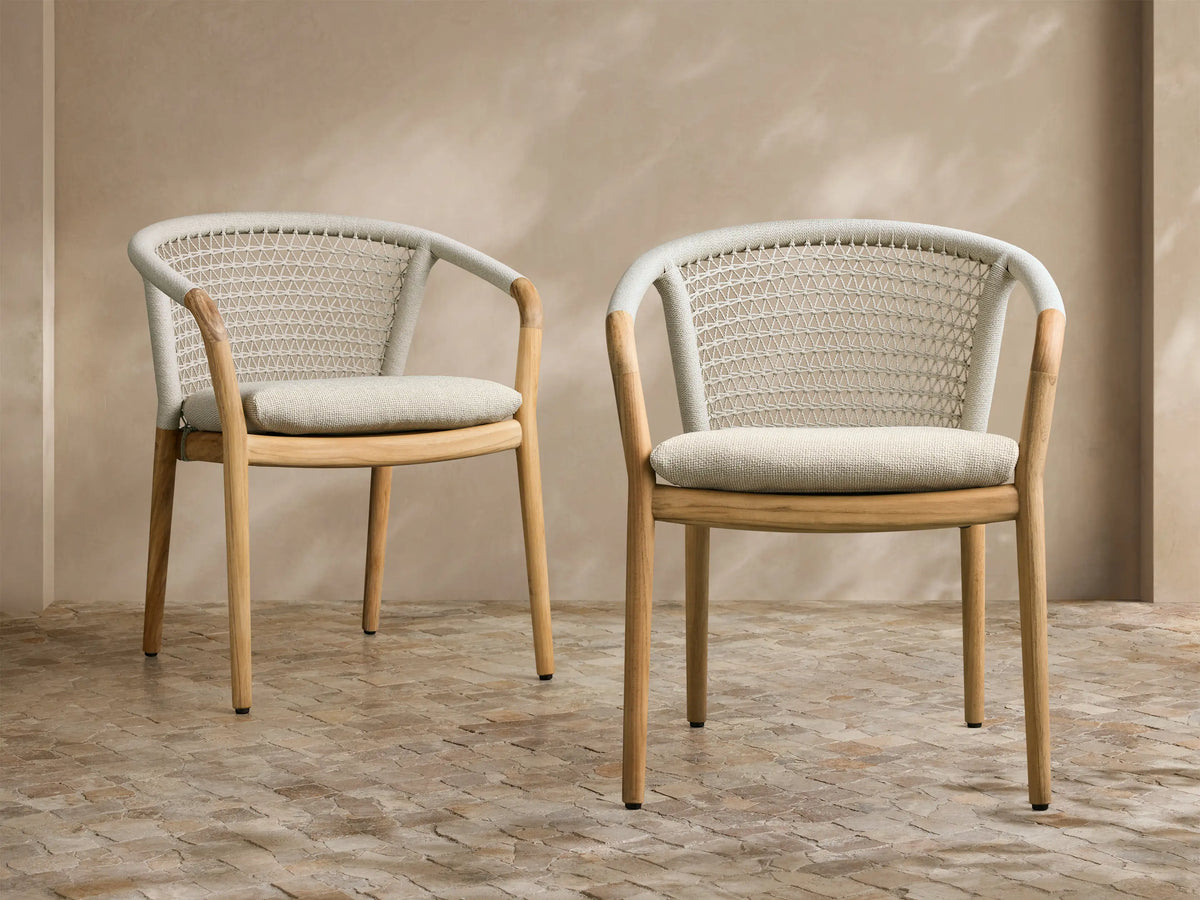 Front view of the Kaia Outdoor Dining Chair with Cushion, with natural teak wood frame, handwoven cream back, and light beige cushion.