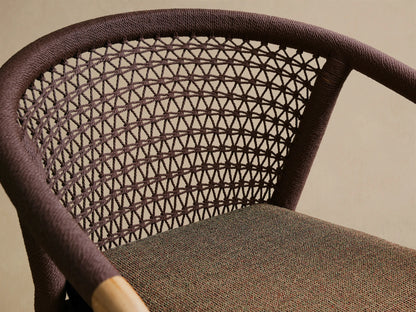 Front-side view of Kaia Outdoor Dining Chair with Cushion, natural teak wood frame, brown woven rope, dark brown cushion.