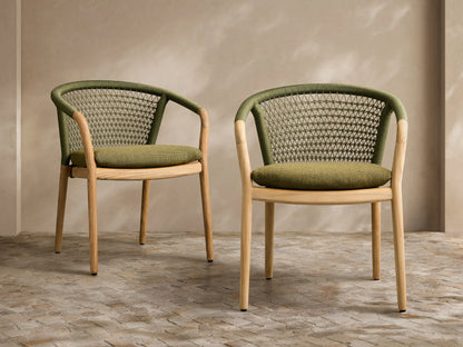 Front view of two Kaia Outdoor Dining Chairs with Cushion. Natural teak frames, green woven backs & matching cushions.