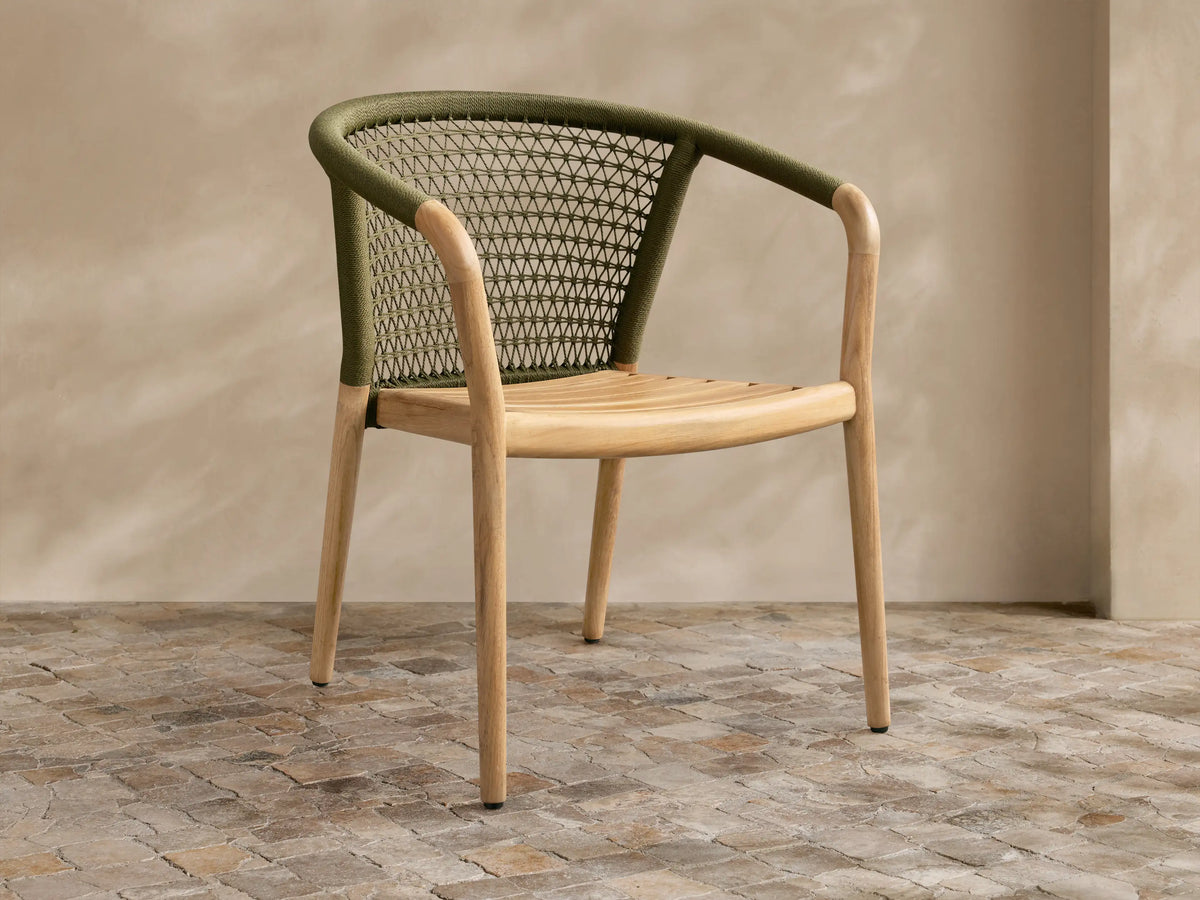 Front view of the Kaia Outdoor Dining Chair with Cushion, showing a natural teak frame, slatted seat, and olive green woven backrest.