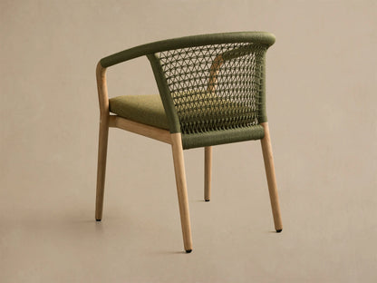 Close-up of the Kaia Outdoor Dining Chair with Cushion, featuring an olive green woven rope back and olive green seat cushion.