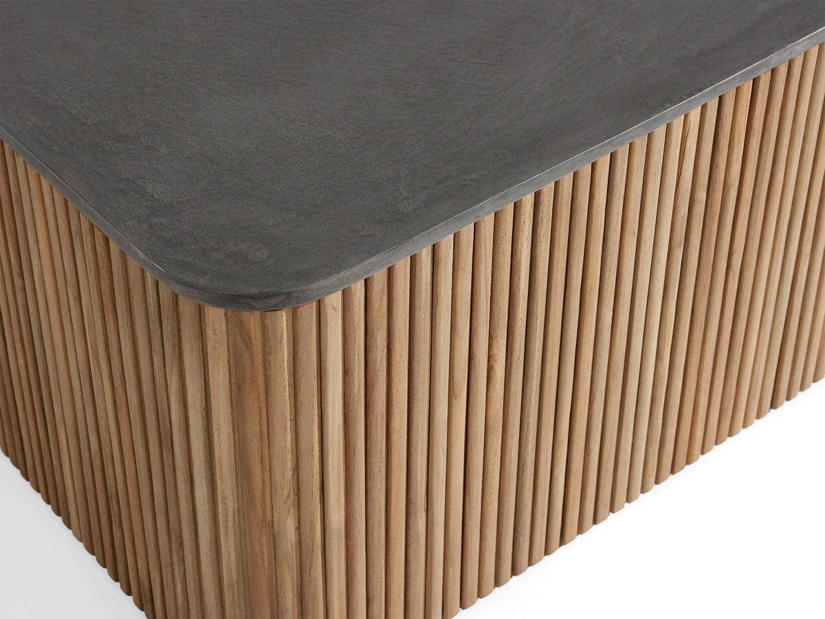 Pompeii Outdoor Coffee Table with a smooth, dark gray concrete top and vertical slatted natural teak wood base.