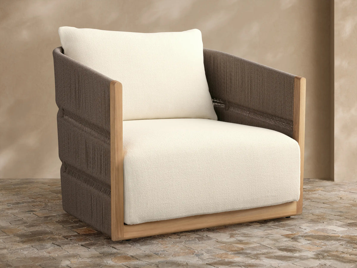 Manadala Outdoor Swivel Chair with natural teak frame, dark brown woven rope arms/back, ivory cushions, on patio tiles.