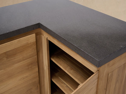 L-shaped Outdoor Teak Modular Kitchen Corner Cabinet with natural teak wood framed door, plain panel, dark gray countertop.