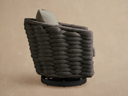 Melbourne Outdoor Swivel Chair, angled back view. Dark gray woven texture, light gray cushion, black circular swivel base.