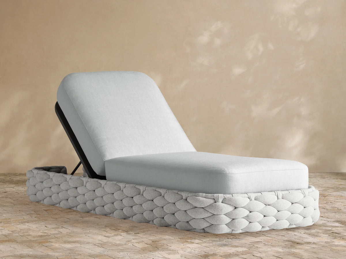 Melbourne Outdoor Replacement Cushion, light grey Rosemount Dove fabric, on an inclined chaise lounge base with woven exterior.
