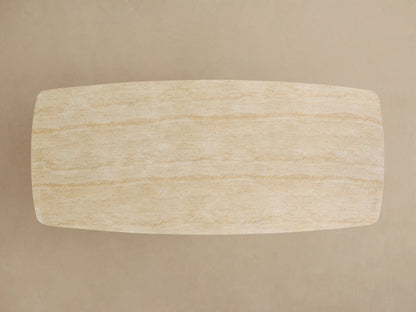 Close-up of an Outdoor Dining Table with a natural light beige, textured sintered stone top and a dark gray Launette base.