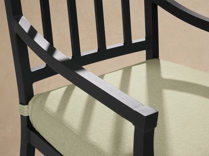 Montego Outdoor Aluminum Dining Arm Chair with a dark gray frame, slatted back, and light green Eden Sage seat cushion. Full view.