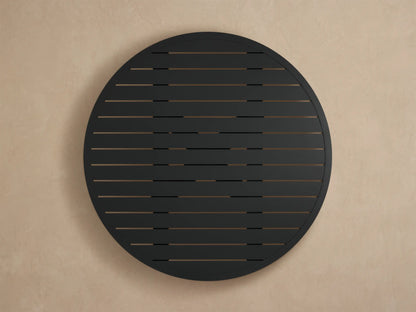 Close-up of Montego Outdoor Aluminum Round Dining Table, showing its dark gray, slatted top & smooth curved edge with textured finish.