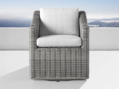 Pale grey Montauk Outdoor Water-Repellent Replacement Cushions: seat & backrest, in a grey wicker chair on an outdoor patio.