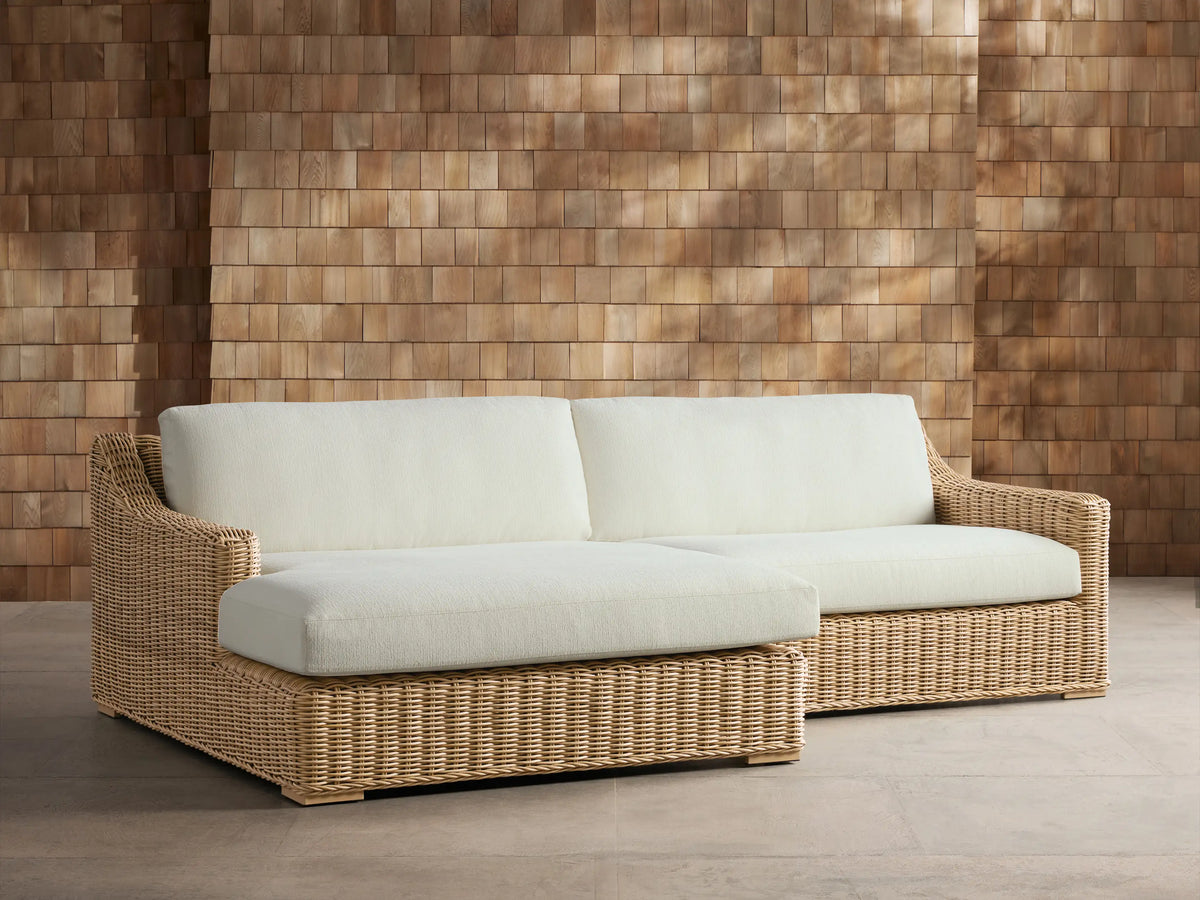 Montauk Outdoor Two-Piece Sectional with cream cushions, light tan woven resin wicker, and left-facing chaise.